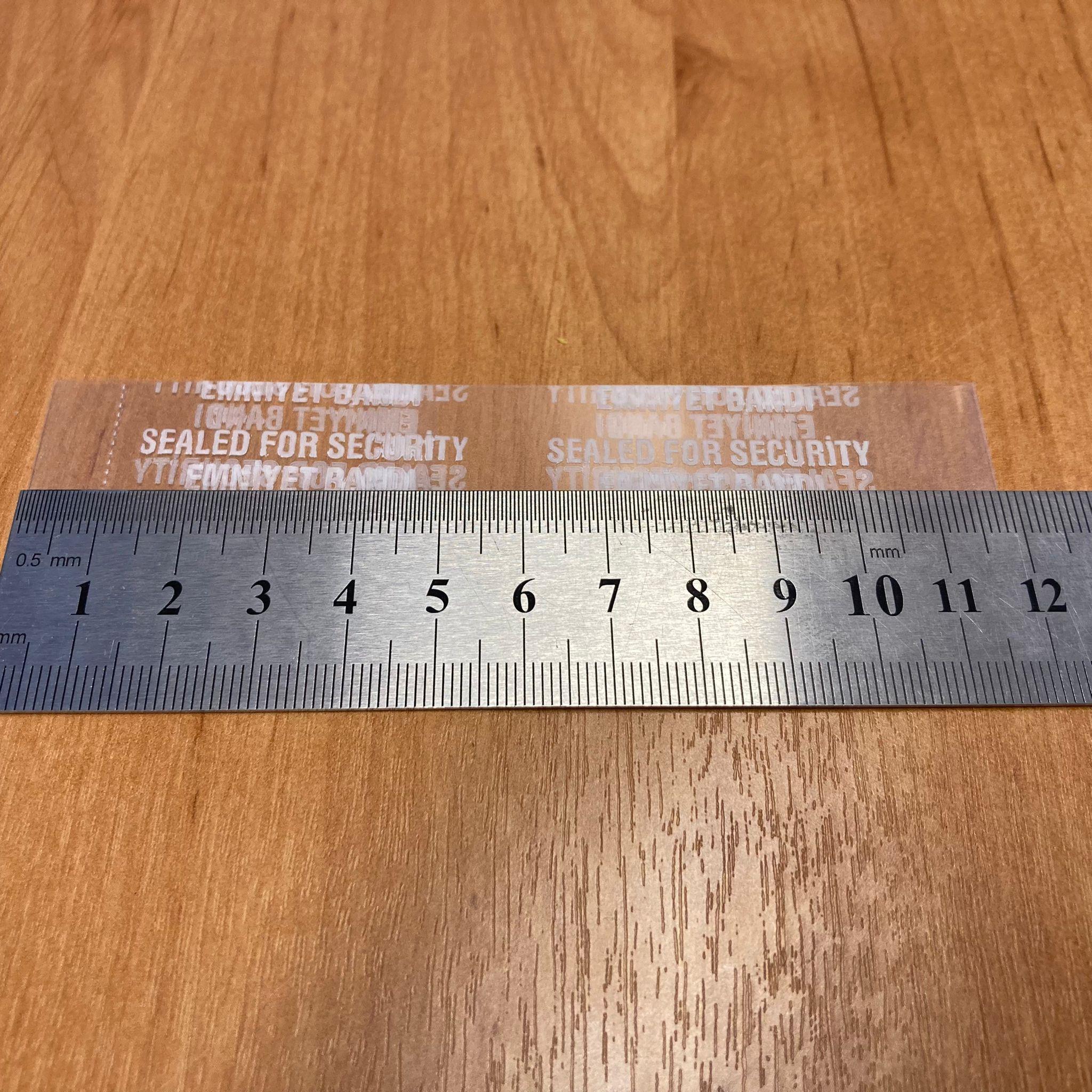EMNİYET BANDI 70 MM AĞIZ UYUMLU - 100 GR - (YAKLAŞIK 190 ADET ) - YAZILI - KAVANOZ GARANTİ BANTI - ŞİŞE EMNİYET BANDI - KAVANOZ GÜVENLİK BANDI