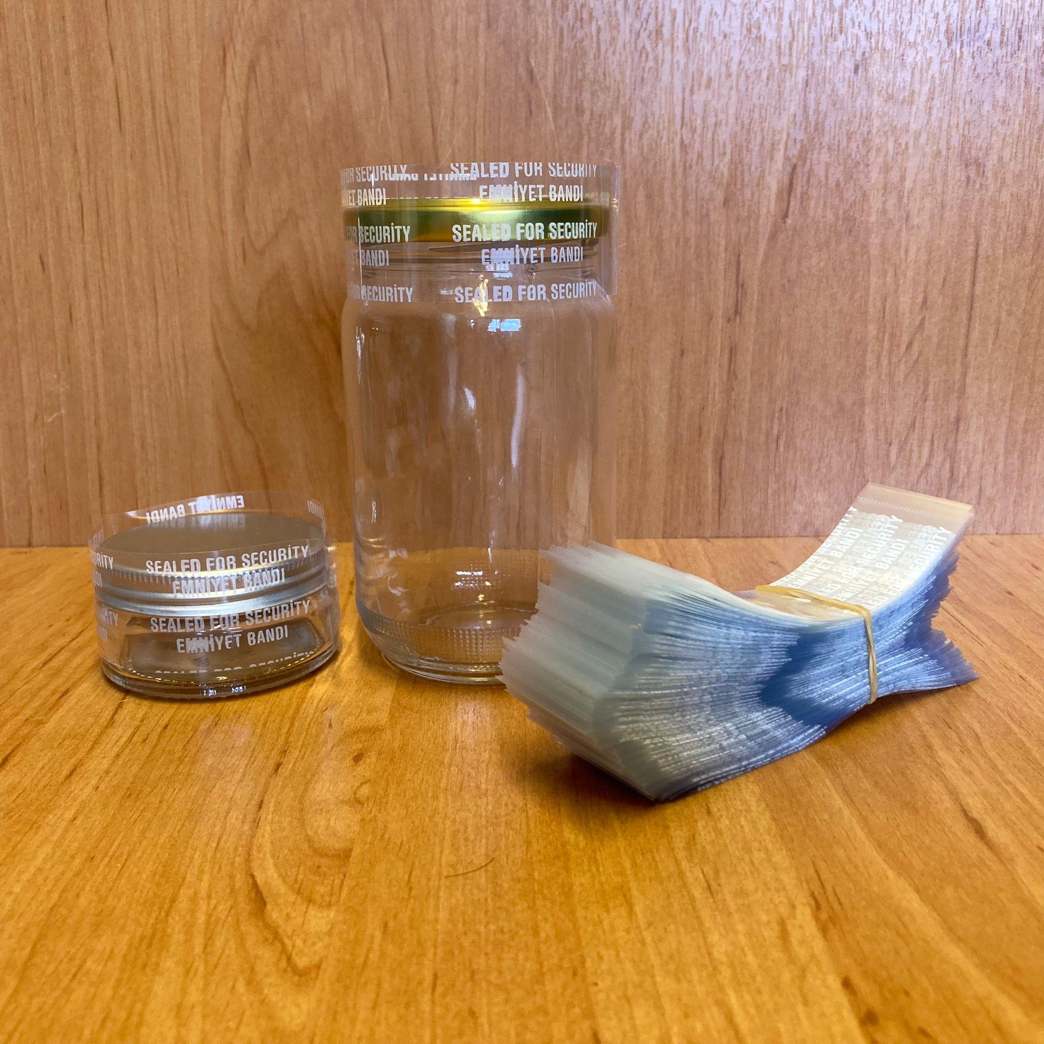 EMNİYET BANDI 57 MM, 58 MM VE 63 MM AĞIZ UYUMLU - 100 GR - (YAKLAŞIK 190 ADET) - YAZILI - KAVANOZ GARANTİ BANTI - ŞİŞE EMNİYET BANDI - KAVANOZ GÜVENLİK BANDI