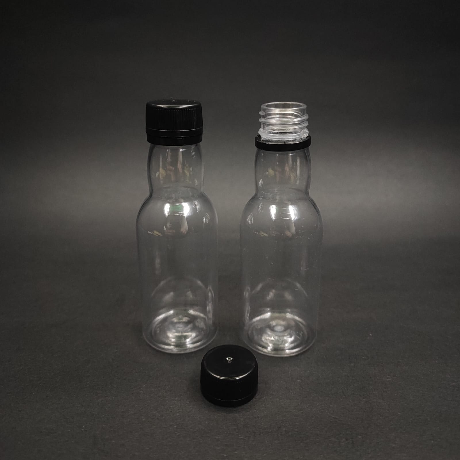 40 CC PET SHOT ŞİŞESİ  - KİLİTLİ SİYAH KAPAKLI KOLAJEN ŞİŞESİ - 40 ML BOĞAZLI PLASTİK ŞİŞE - ŞEFFAF (KİLİTLİ KAPAK SERTÇE BASTIRARAK KAPANIR)
