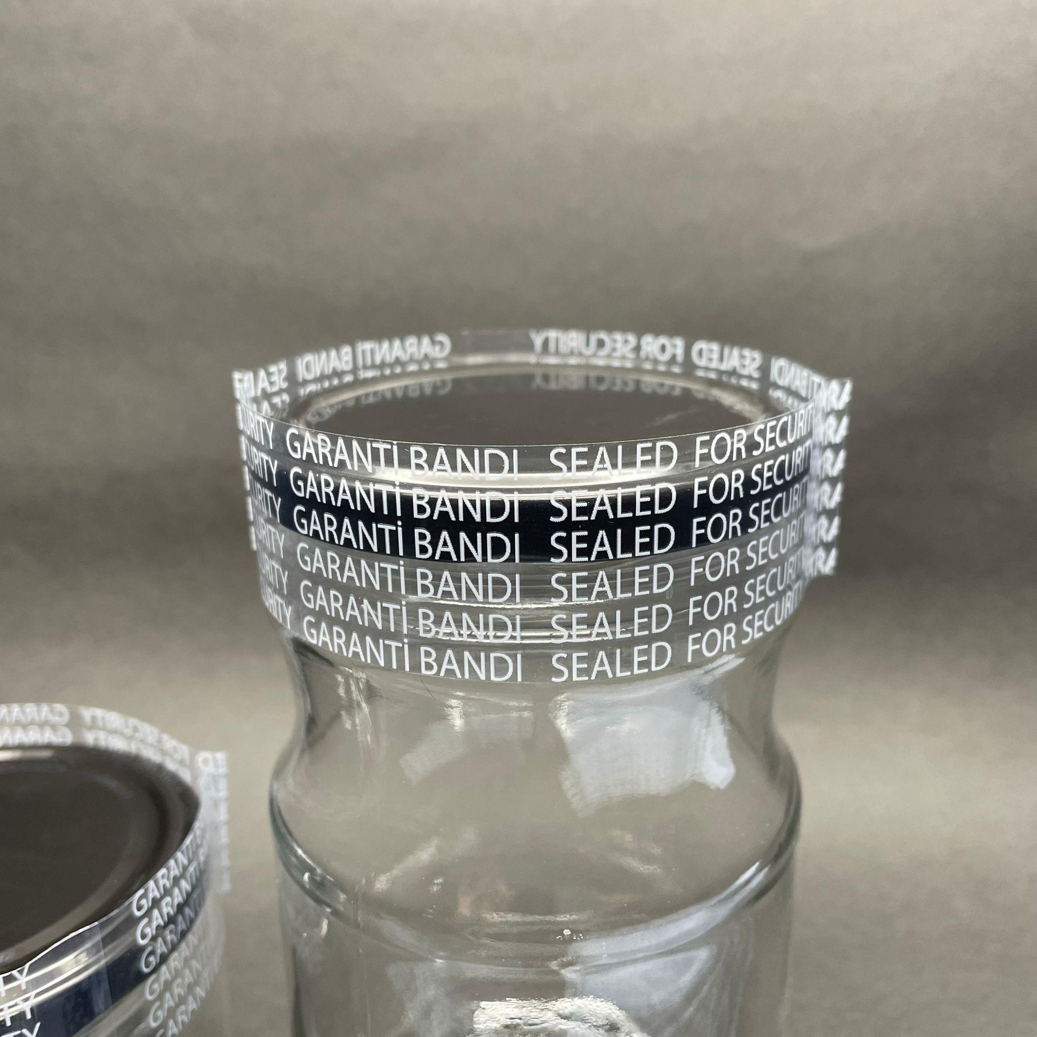 EMNİYET BANDI 82 MM AĞIZ UYUMLU - 100 GR - (YAKLAŞIK 194 ADET) - YAZILI - KAVANOZ GARANTİ BANTI - ŞİŞE EMNİYET BANDI - KAVANOZ GÜVENLİK BANDI