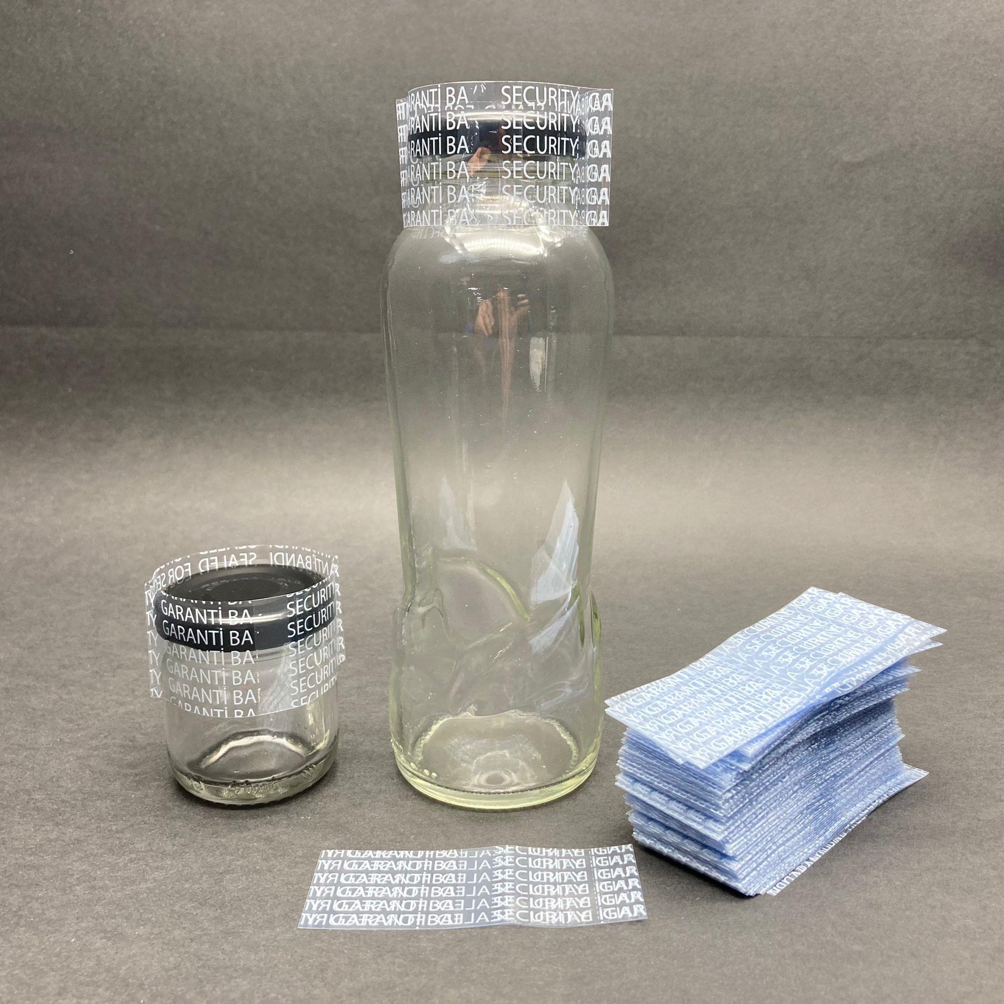 EMNİYET BANDI 38 MM VE 43 MM AĞIZ UYUMLU - 100 GR - (YAKLAŞIK 300 ADET) - YAZILI - KAVANOZ GARANTİ BANTI - ŞİŞE EMNİYET BANDI - KAVANOZ GÜVENLİK BANDI