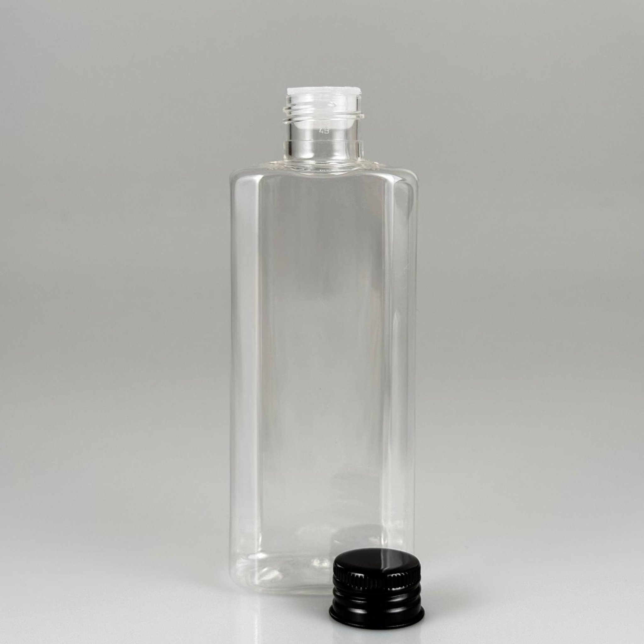200 CC YASSI MODEL ŞEFFAF PET ŞİŞE (24 AĞIZ) + KÖPÜK CONTALI SİYAH METAL ALÜMİNYUM KAPAK + KOLONYA TIPALI TAKIM - 200 ML KAPAKLI PLASTİK ŞİŞELER