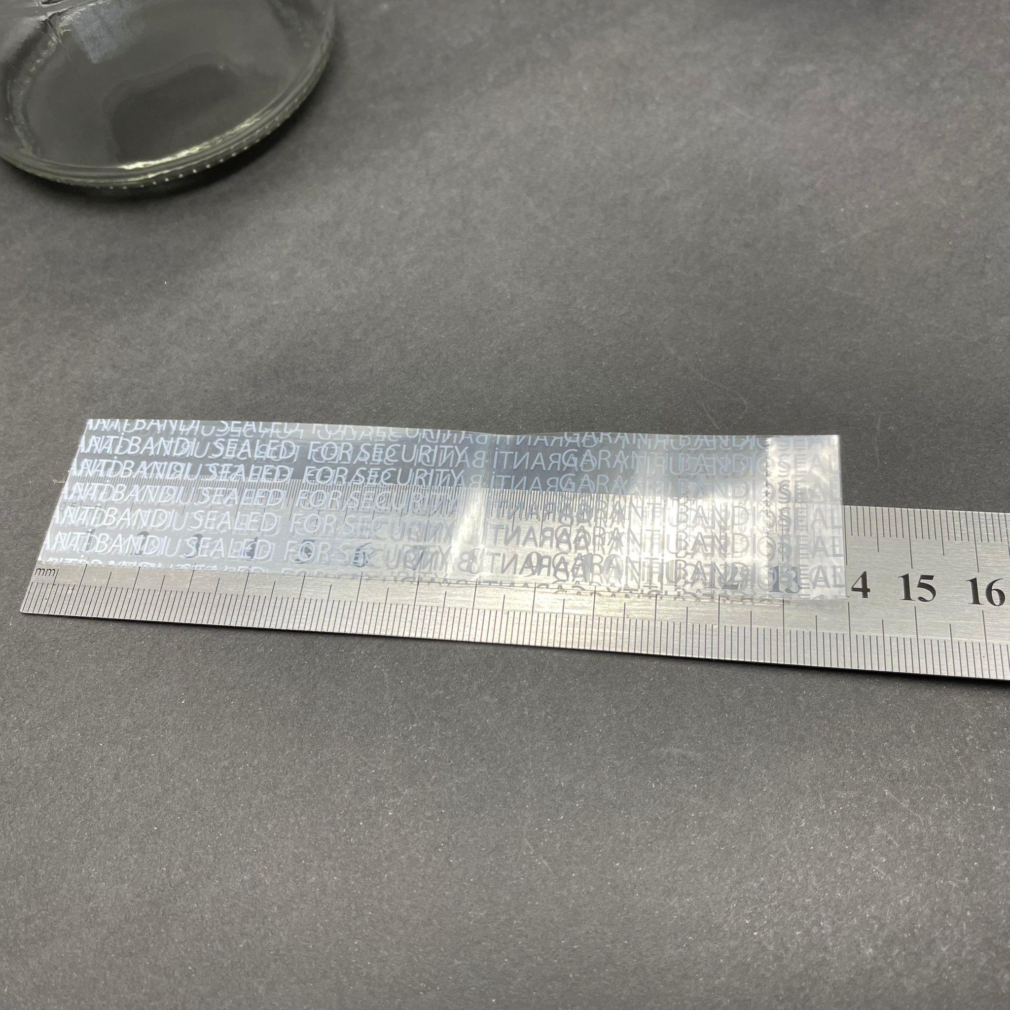 EMNİYET BANDI 82 MM AĞIZ UYUMLU - 100 GR - (YAKLAŞIK 194 ADET) - YAZILI - KAVANOZ GARANTİ BANTI - ŞİŞE EMNİYET BANDI - KAVANOZ GÜVENLİK BANDI