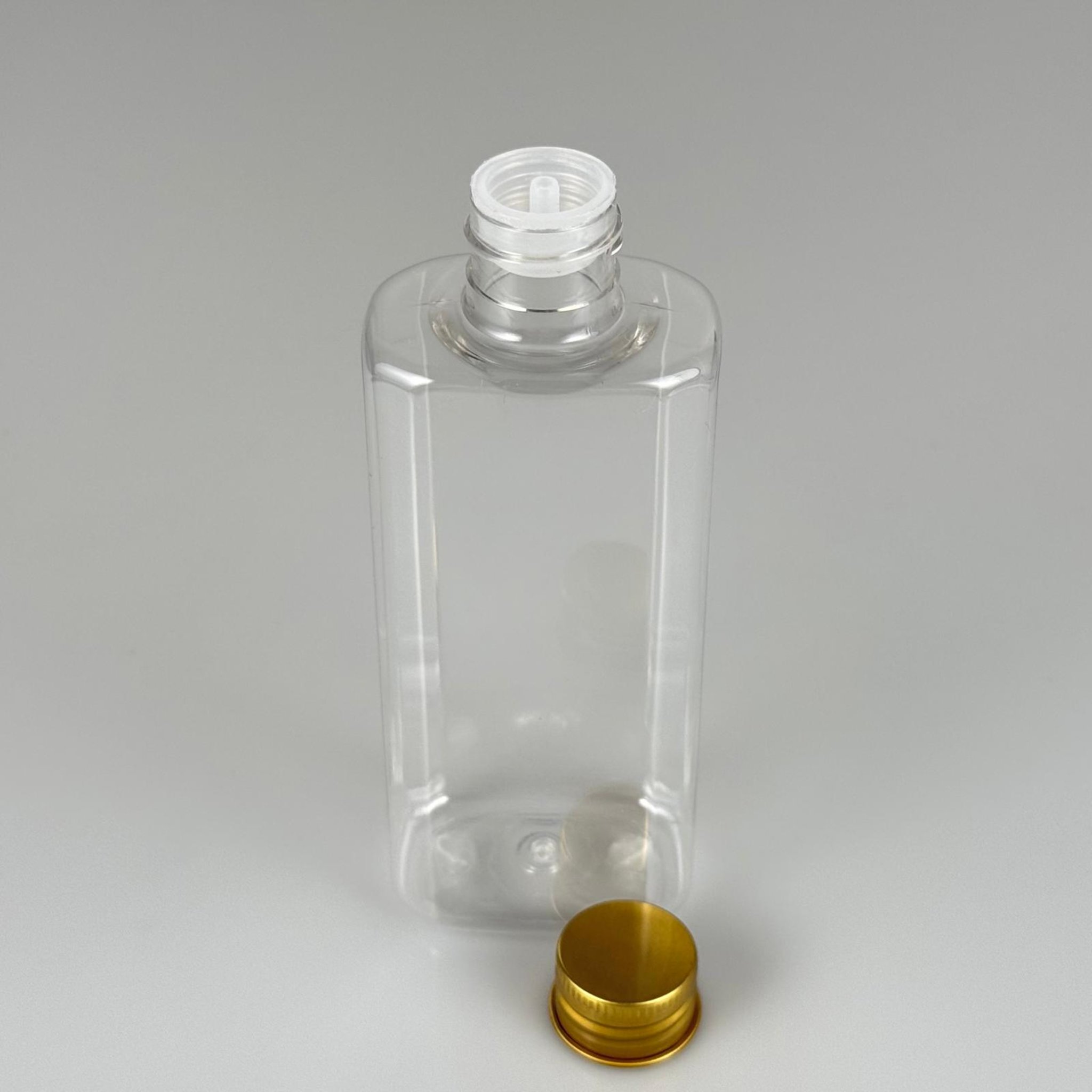 200 CC YASSI MODEL ŞEFFAF PET ŞİŞE (24 AĞIZ) + KÖPÜK CONTALI GOLD METAL ALÜMİNYUM KAPAK + KOLONYA TIPALI TAKIM - 200 ML KAPAKLI PLASTİK ŞİŞELER
