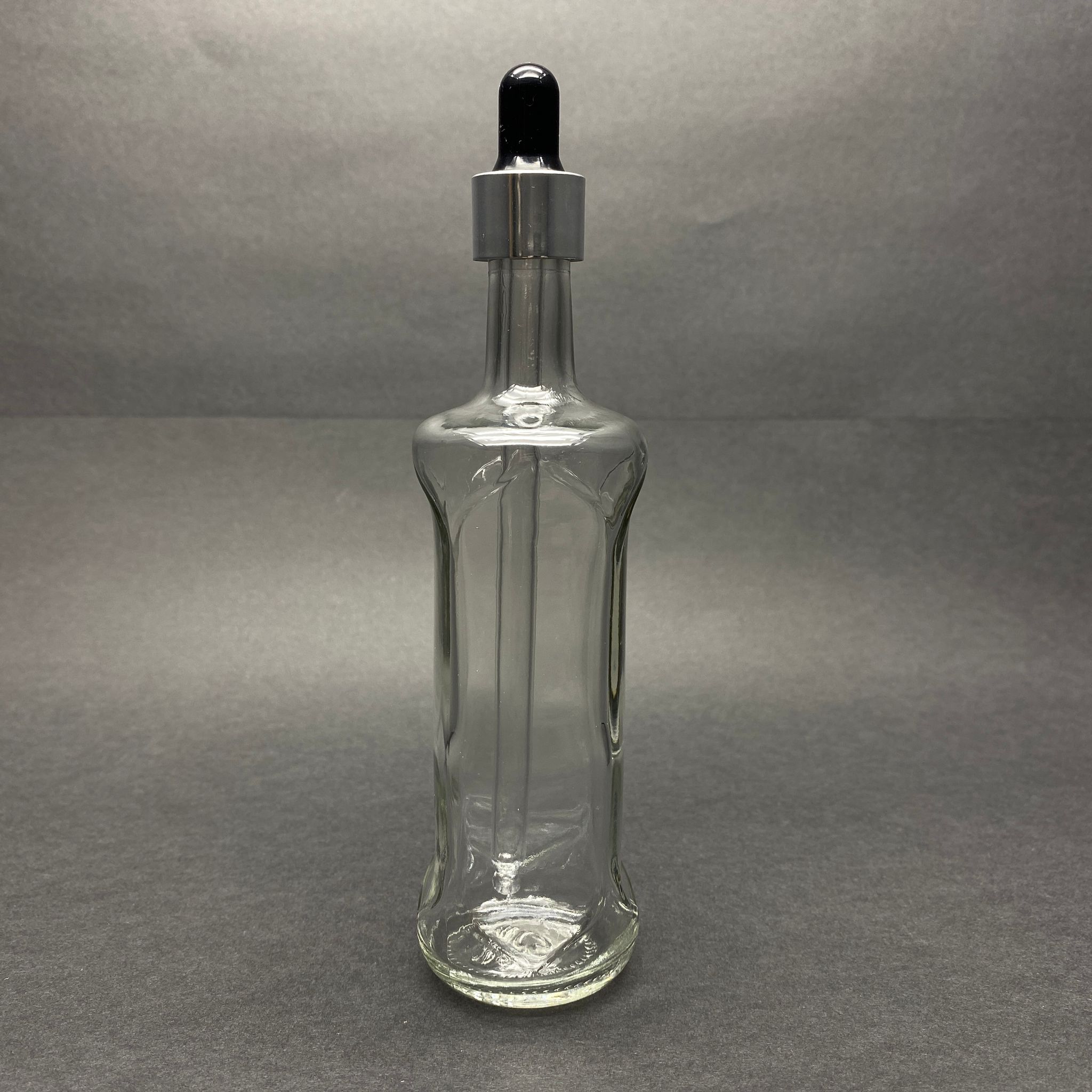 100 CC ŞEFFAF CAM DAMLALIKLI ŞİŞE DORİKA MODEL - SİYAH EMZİK - GÜMÜŞ METAL KAPAK - 100 ML SAYDAM CAM DAMLALIKLI ŞİŞE